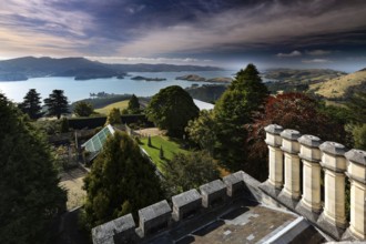 View from Larnach Castle tower across manicured gardens to the coast, Otago Peninsula, New Zealand