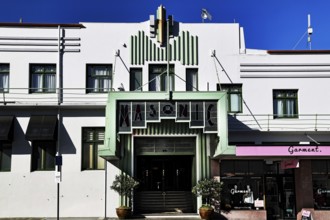 Art Deco building with distinctive green entrance under blue sky, Napier, Hawke's Bay, New Zealand