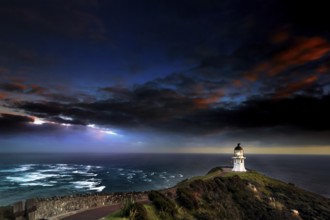 Confluence of Tasman Sea and Pacific at Cape Reinga with lighthouse and color sky, Cape Reinga,