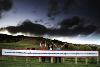 Long sign with the world's longest place name against a dramatic sky