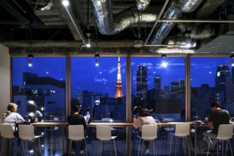 Nighttime view of Tokyo's illuminated skyline from a modern room, Tokyo, Japan
