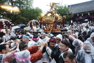 Crowd in rainy weather at Sanja Matsuri in Asakusa, Tokyo, Japan