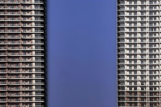 Skyscrapers with modern architecture against a clear blue sky, Tokyo, Tokyo Bay, Japan