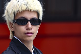 Young man with blonde hair and sunglasses in modern style, Tokyo, Asakusa, Japan