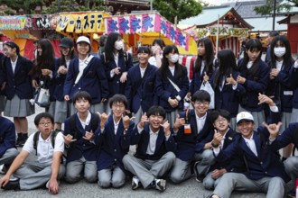 Group of students in uniform pose happily during a trip to Asakusa, Tokyo, Asakusa, Japan