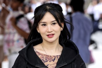 Smiling woman with black hair in busy street of Asakusa, Tokyo, Tokyo, Asakusa, Japan
