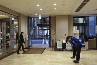 Entrance area of an elegant shopping center with visitors, Tokyo, Ginza, Chuo, Japan