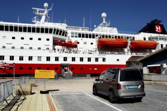 Car parked in front of a Hurtigruten ship in the port of Kirkenes, Kirkenes, Finnmark, Norway
