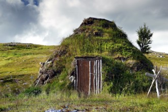 A traditional moss-covered seed hut in the countryside near Hammerfest, Hammerfest, Finnmark,