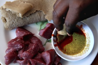 Tire Siqa served with raw meat and injera in Debark, Debark, Amhara, Ethiopia