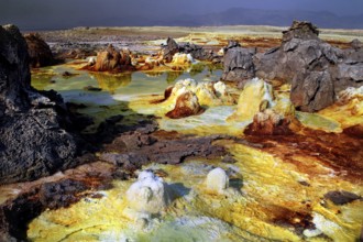 Dynamic volcanic landscape in Dallol with orange and black rocks, Dallol, Afar region, Ethiopia
