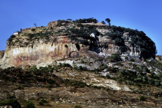 A monastery perched on a wooded plateau under clear skies, Debre Damo, Tigray, Ethiopia