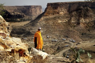 Abba Philippos looks out of the vast countryside from a cliff, Debre Damo, Tigray, Ethiopia