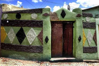 Colourfully decorated walls in an alley in Harar's old town, Harar, Ethiopia