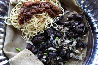 Creative combination of spaghetti and traditional Ethiopian dish in Hirna