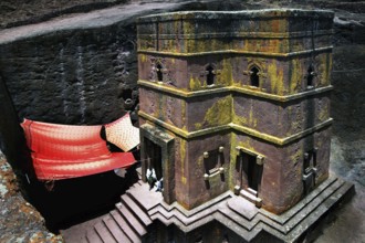 Bete Gyorgis rock church in cross shape with red carpet and stairs, Lalibela, Amhara, Ethiopia