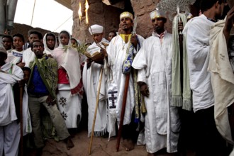 A group of men standing together in a religious procession, Lalibela, Amhara, Ethiopia