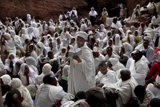 Believers in white robes gather for an Easter service in Bete Maryam, Lalibela, Ethiopia