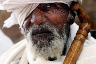 Portrait of an elderly man wearing a turban, deep in thought, Lalibela, Amhara, Ethiopia