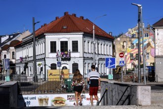 Vilnius Gatve in Kaunas with pedestrians and colorful buildings under blue sky, Kaunas, Kaunas,