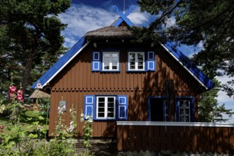The Thomas Mann house in Niden with blue shutters under a blue sky, Nidden, Lithuania
