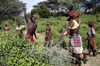 Hamer woman in a traditional initiation scene, with a focus on a flogging, Turmi, Ethiopia