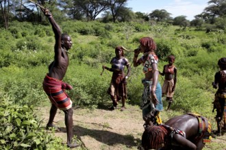 A group of Hamer woman perform a flogging, part of their initiation ceremony, Turmi, Ethiopia