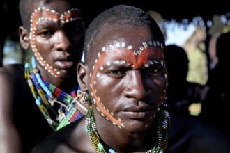 Close-up of Hamer men with artistic face painting, Turmi, Ethiopia