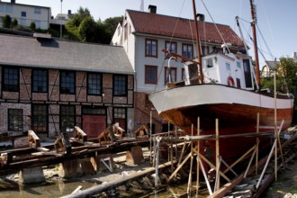 Mellemværftet shipyard on Kirkelandet with historic houses and ship, Kristiansund, Møre og Romsdal,