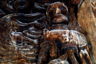 Wood-carved figure in the ornate door frame of the stave church in Heddal, Heddal, Norway