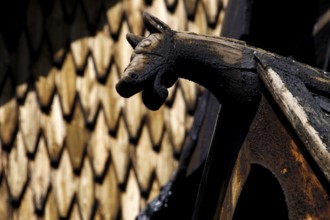 Roof figure of a stave church in Heddal with detailed wood carving, Heddal, Notodden, Norway