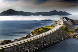 Spectacular view of the winding road across the Atlantic road with surrounding mountains and