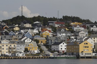 Panorama of Nordlandet in Kristiansund with densely connected colorful houses on the coast,