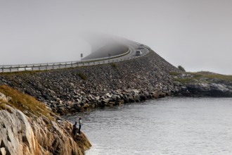 Atlantic road crosses the sea through fog and connects small islands, Atlanterhavsveien, Møre og