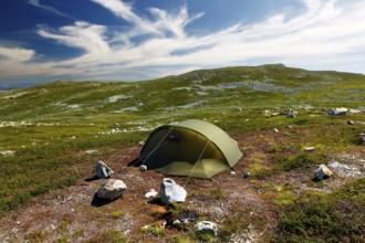 A secluded camping site with a tent against a mountain backdrop, Hardangervidda, Gausdal, Norway