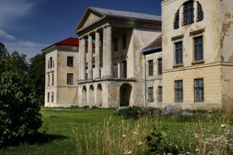 Historic building with decorated facades surrounded by nature in the Kolga manor house, Kolga,
