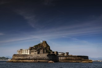 Ruined city on Hashima island known as Gunkanjima seen from the sea, Nagasaki, Kyushu, Japan