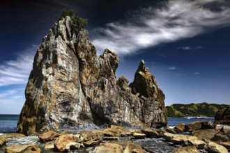 Weather-eroded rocks on the coast under a cloudy sky, Kushimoto, Wakayama, Japan