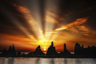 Impressive sunbeams over rock formations at dawn, Kushimoto, Japan