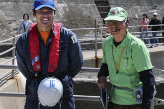 Two friendly guides during a shore trip on the deserted island of Gunkanjima, Nagasaki, Kyushu,