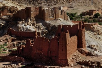 Red sandstone ruins in a desert-like landscape in the Ounilla Valley