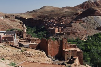 Historic red sandstone buildings nestled in the green Ounilla Valley