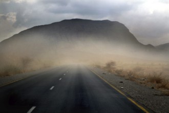 Road in a sandstorm in front of a mountain in Shehet, Shehet, Ethiopia