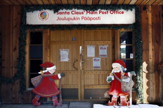 Santa Claus Village Post Office wooden building with festive Santa Claus decoration, Napapiiri,