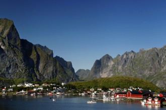 Reine on the coast with picturesque mountains and clear waters of Lofoten, Reine, Moskenesøy,
