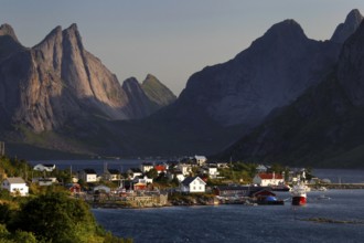 Hamnøay village with a view of the sea and distinctive mountain scenery of Lofoten, Hamnøay,
