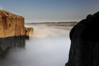 Breathtaking view of the misty landscape around Kjeragbolten, Kjerag, Rogaland, Norway