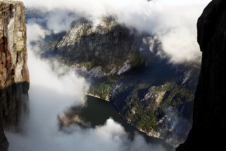 Breathtaking view of Lysefjord through clouds and between steep rocks, Lysefjord, Norway