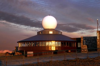 North Cape Visitor Center with dome in golden evening light, North Cape, Magerøya, Norway