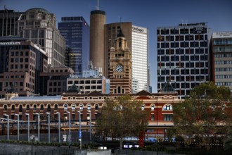 Flinders Street Station in Melbourne with surrounding modern buildings, Melbourne, Victoria,